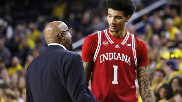 Indiana coach Mike Woodson talks to center Kel'el Ware (1) during the Hoosiers' matchup with Michigan.   